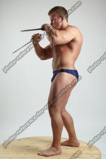 ADAM_WARD STANDING WITH TWO DAGGERS